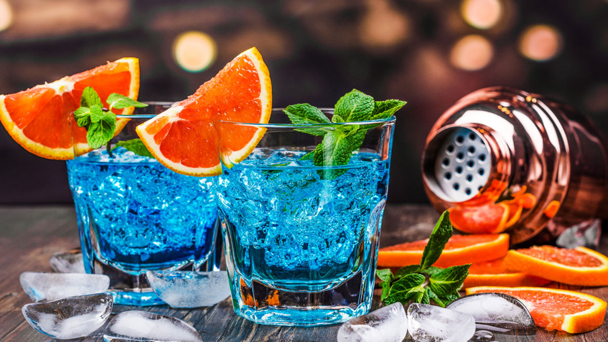 The Ultimate Guide to Blue Curaçao: History, Uses, and Cocktail Recipes
